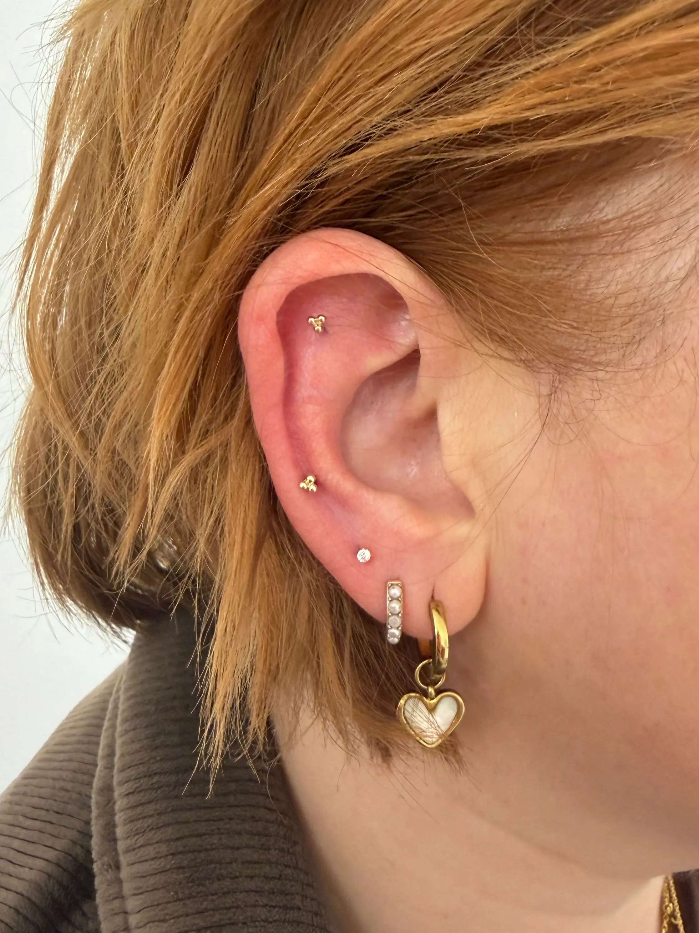 Ear piercing by Lucy — recent client work